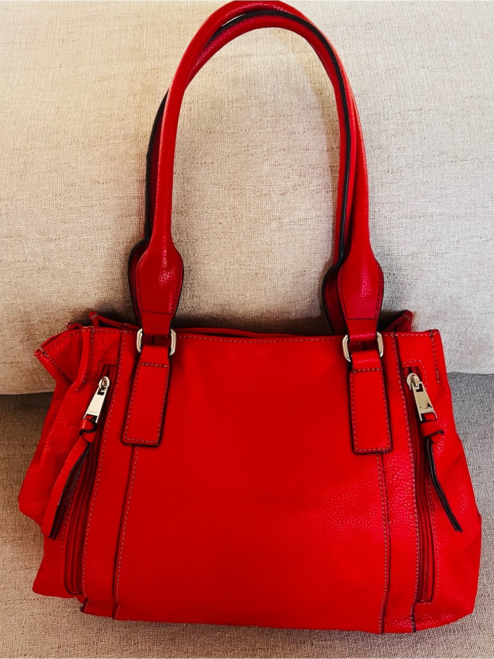 Red Tignanello shoulder bag features a textured leather and silver-toned